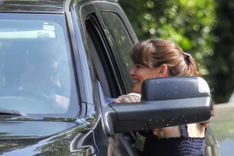 Jennifer Garner looks smitten with her boyfriend John Miller while chatting with him through the..
